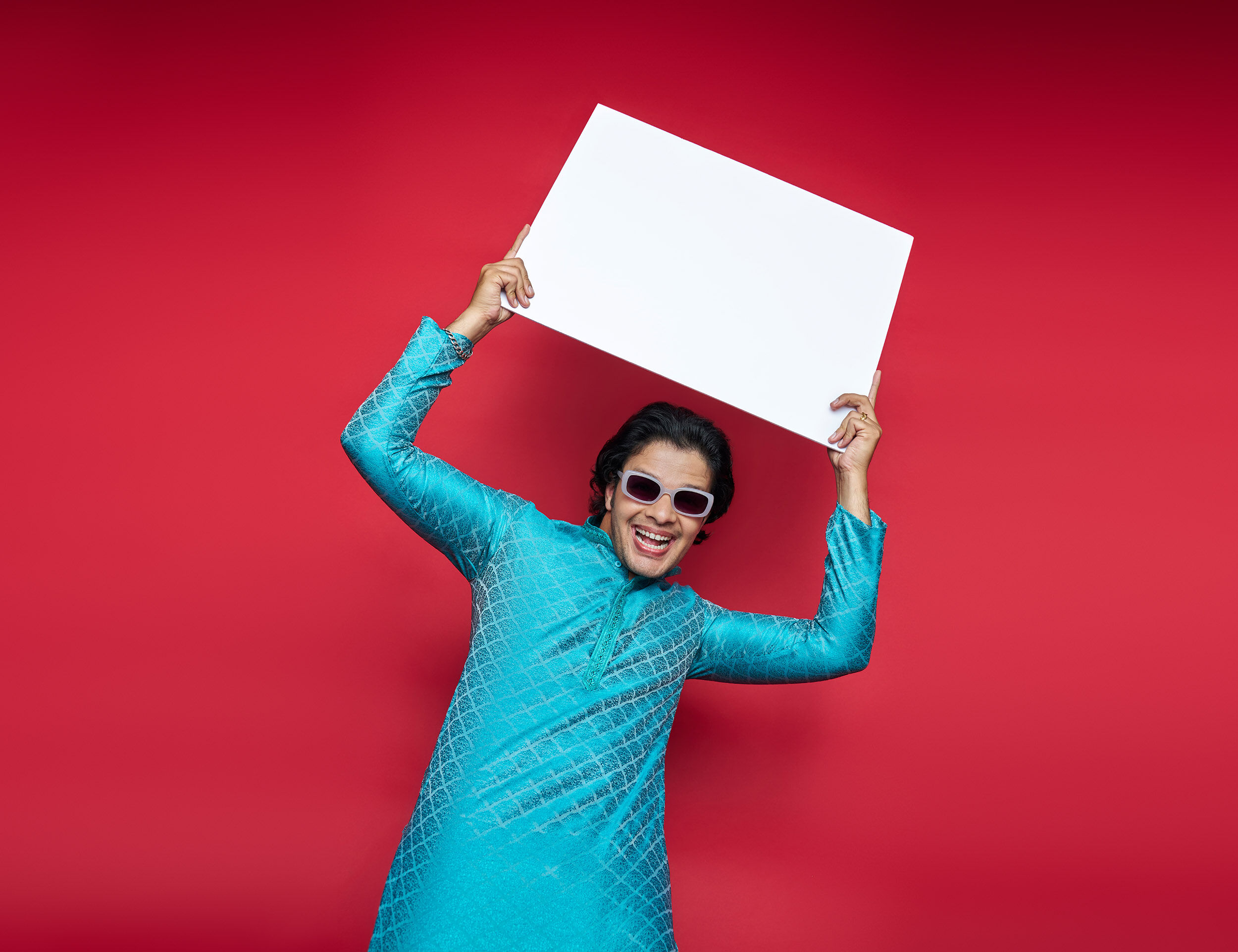 Model in a fitted turquoise kurta showcasing a well-tailored shoulder and chest fit, blending comfort with contemporary style.